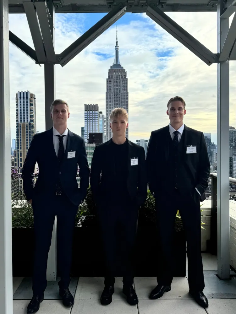 The Call Company team on a New York rooftop with the Empire State Building behind